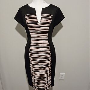 Black and pink cocktail dress new with tags includes free matching earrings.